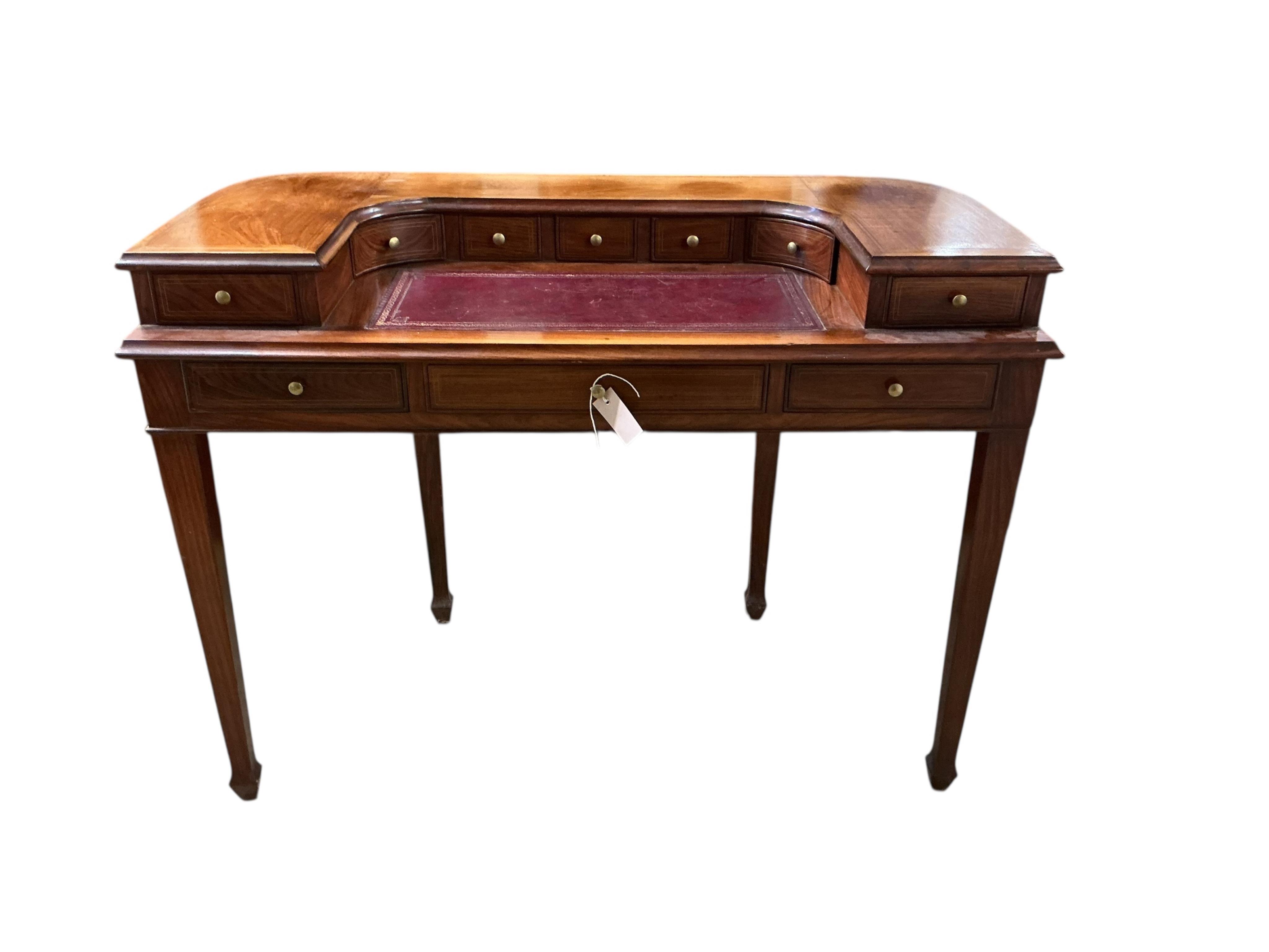 A reproduction brass inlaid mahogany Carlton House type desk, width 116cm, depth 54cm, height 87cm